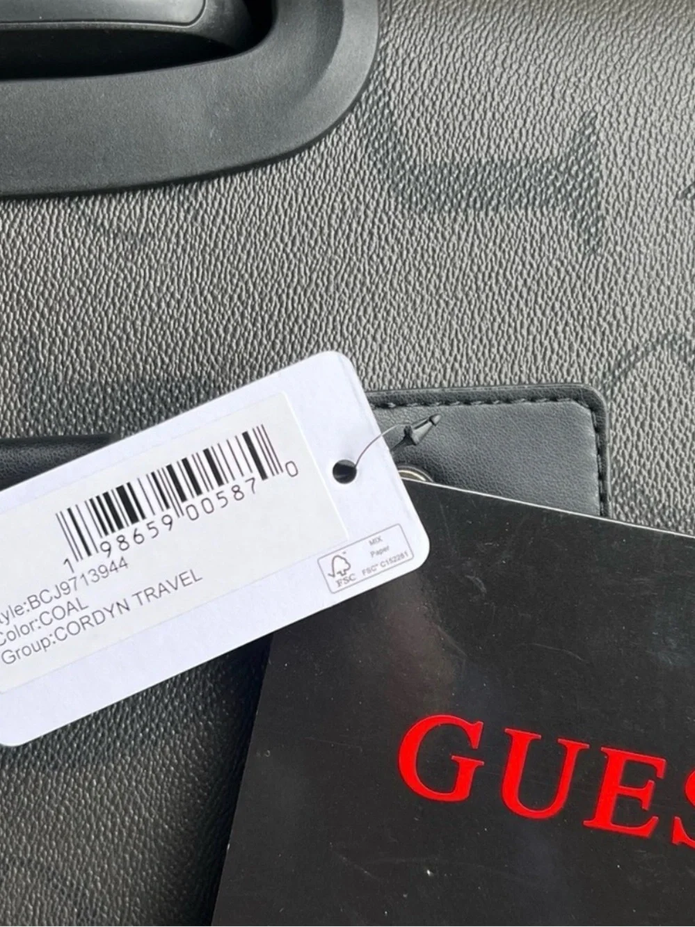 GUESS Logo Debossed Black Rolling Suitcase 24 “